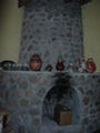 Adobe Inn Fireplace with local wares on Mantle